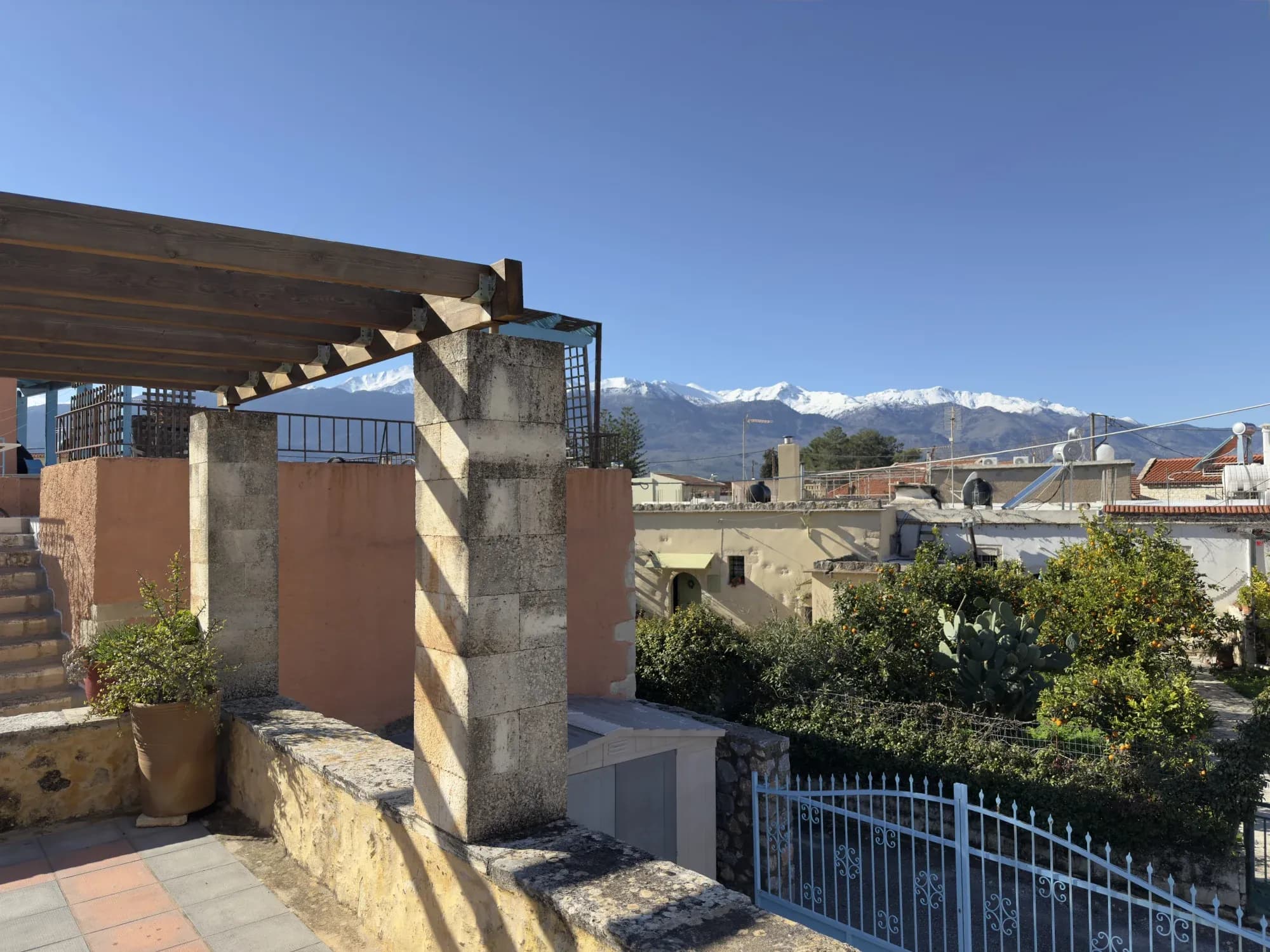 Rooftop terrace with snow-capped White Mountains panorama
